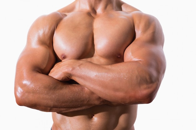 Mid section of shirtless muscular man