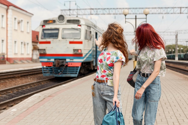 Mid shot women in train station