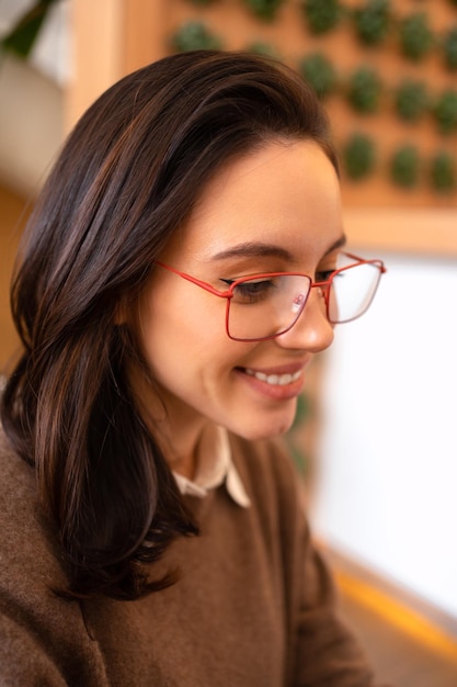 Middle age beautiful businesswoman wearing glasses