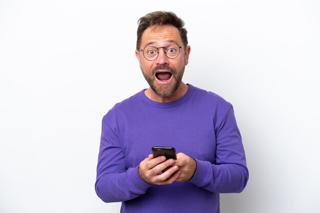 Middle age caucasian man isolated on white background surprised and sending a message