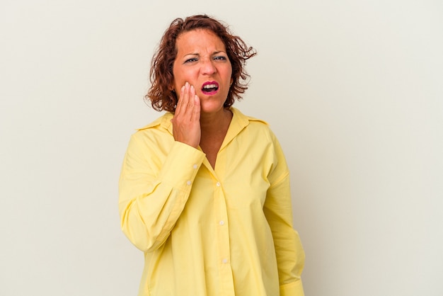 Middle age latin woman isolated on white background having a strong teeth pain, molar ache.