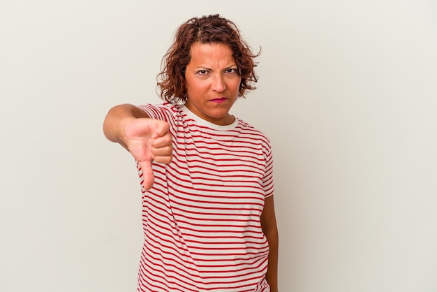 Middle age latin woman isolated on white background showing thumb down, disappointment concept.