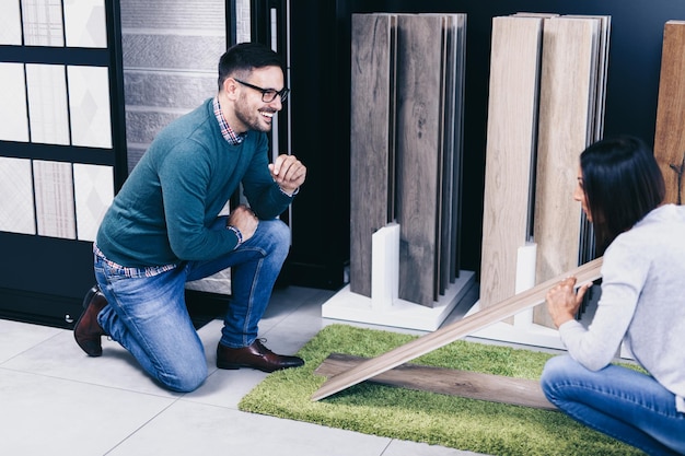 Middle age man choosing ceramic tiles and floor decoration