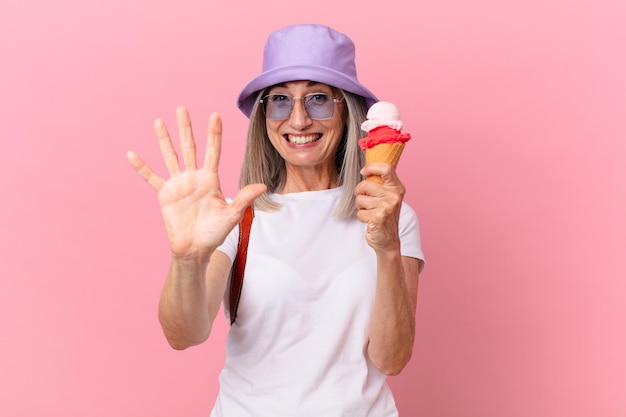 Middle age white hair woman with an ice cream summer concept