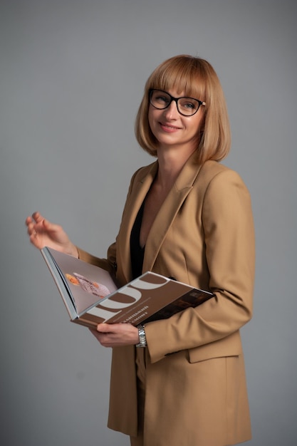 Middle age woman with eyeglasses and book