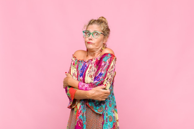 Middle age woman with long curly hair isolated