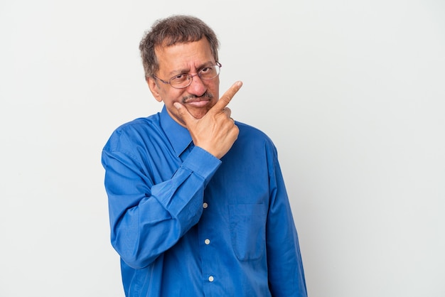 Middle aged indian man isolated on white background contemplating, planning a strategy, thinking about the way of a business.