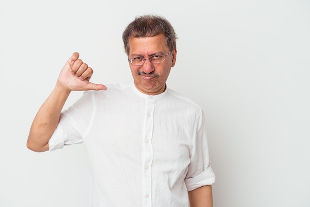 Middle aged indian man isolated on white background showing thumb down, disappointment concept.