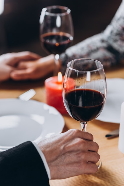 Middle-aged loving couple have a romantic dinner close-up