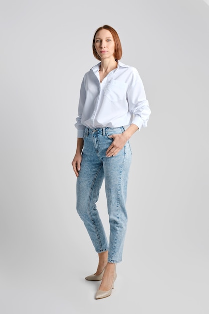 Middle aged model wearing casual shirt and jeans