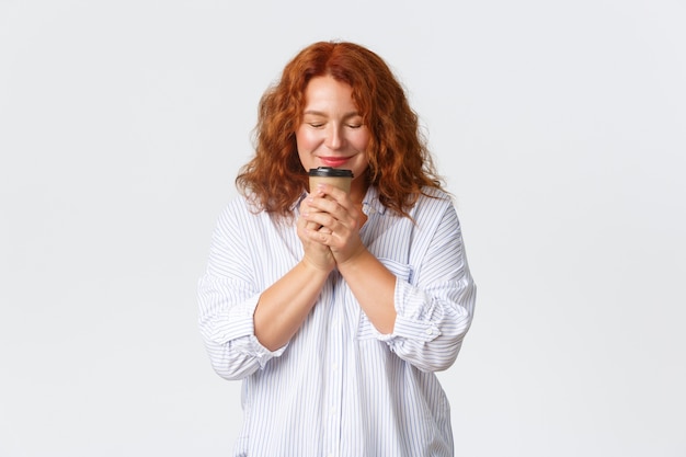 Middle-aged redhead woman posing