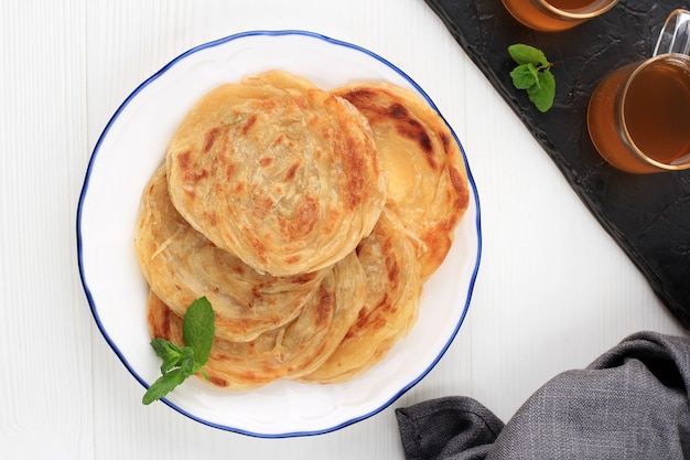 Middle East Canai or Paratha Flat Bread, or also known as Roti Maryam in Indonesia. Isolated on White Background with Copy Space for Text