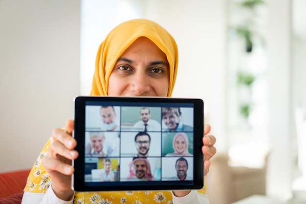 Middle Eastern businesswoman having online conference at home