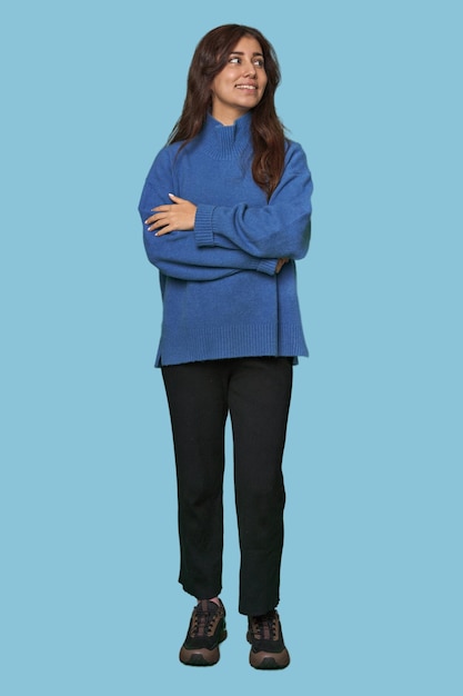 Middle Eastern woman full body studio smiling confident with crossed arms