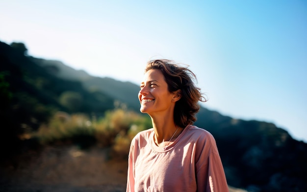 Middleage woman breathing fresh air in the mountains