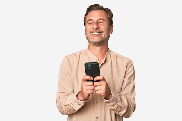 A middleaged man using his phone