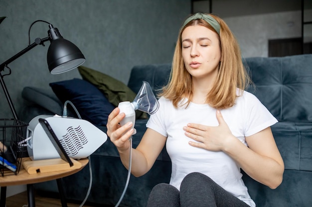 middleaged woman makes inhalation at home Cold respiratory diseases Influenza and viral infection