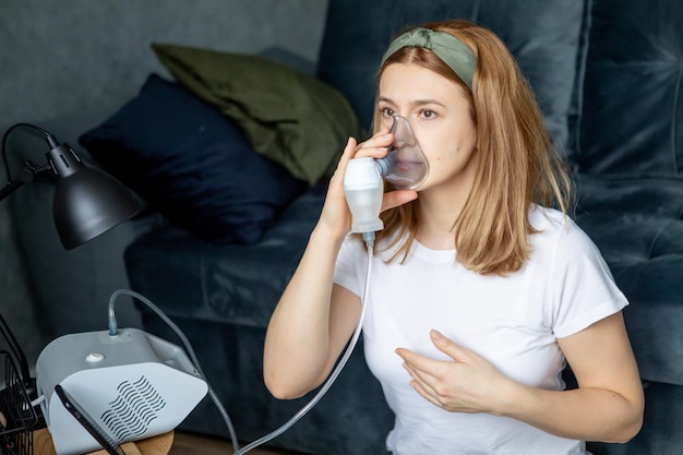 middleaged woman makes inhalation at home Cold respiratory diseases Influenza and viral infection