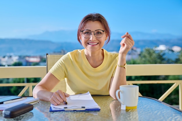 Middleaged woman talking mentor tutor teacher looking at webcam