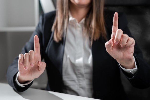 Midsection of businessman gesturing thumbs up