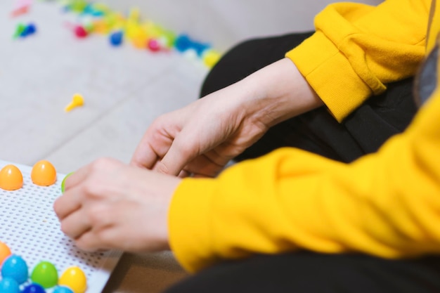 Photo midsection of hand playing game on table