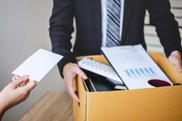 Photo midsection of man holding book on table