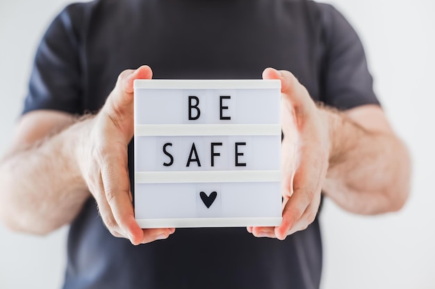 Photo midsection of man holding text against white background