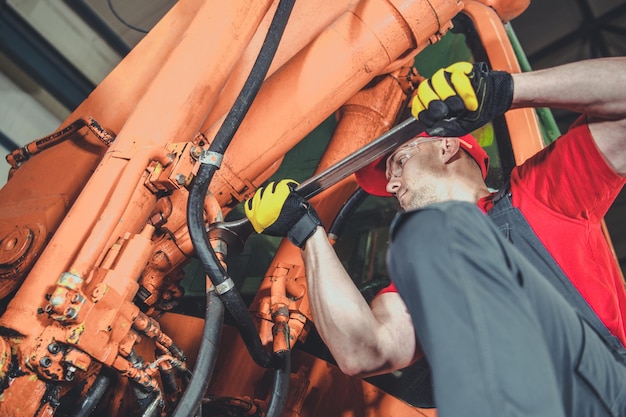 Photo midsection of man repairing vehicle