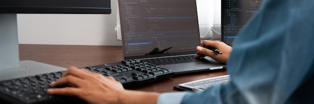 Midsection of man using laptop on table