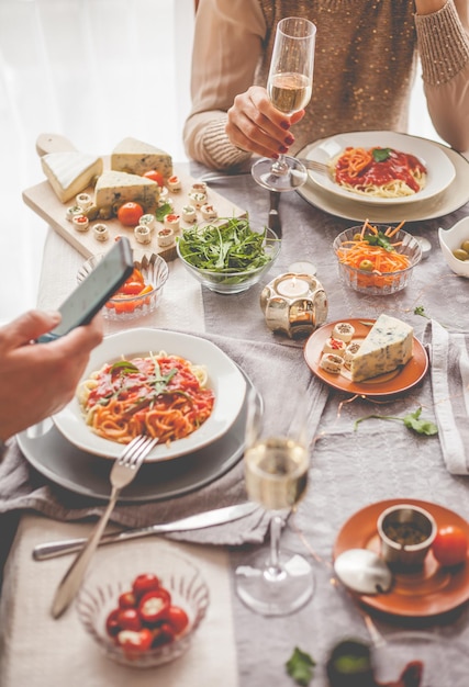 Midsection of people having food at home