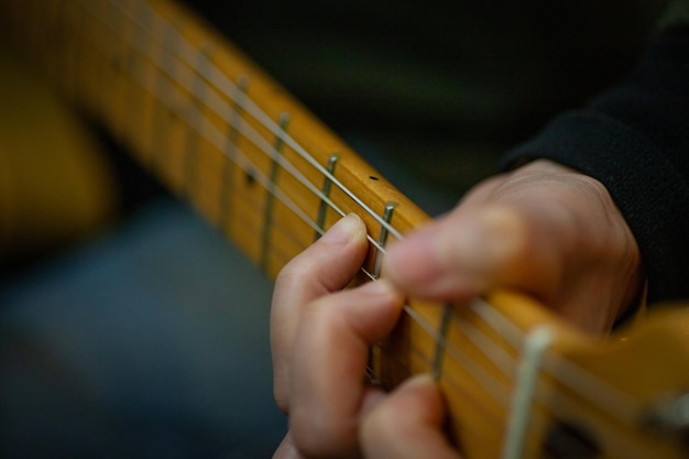 Photo midsection of person playing guitar