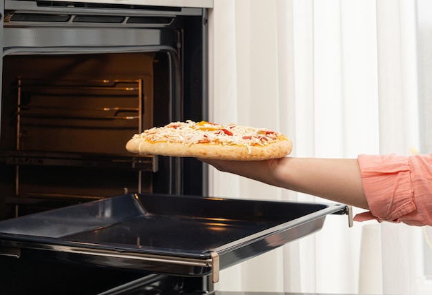 Photo midsection of person preparing food in kitchen