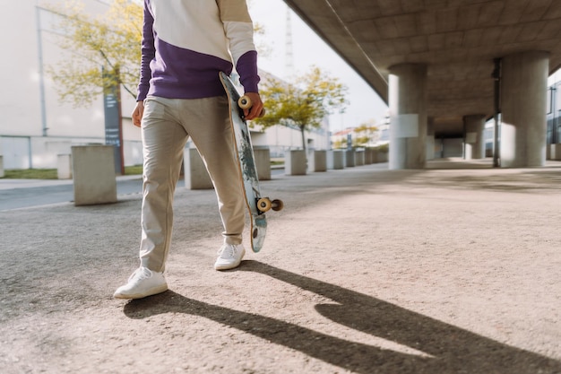 Midsection of skateboarder Urban spot Photo with copy space High quality photo