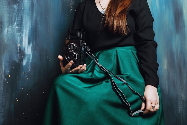 Photo midsection of woman holding camera