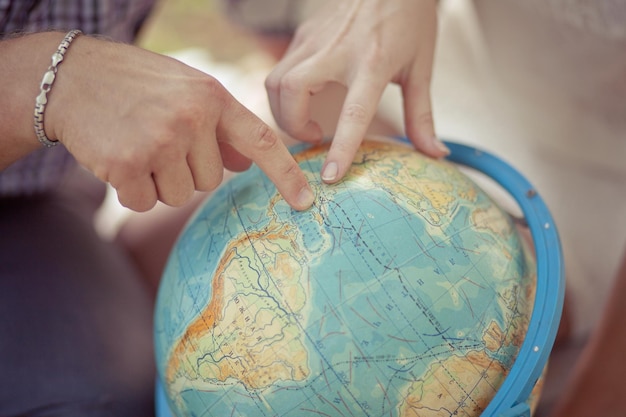 Photo midsection of woman holding globe