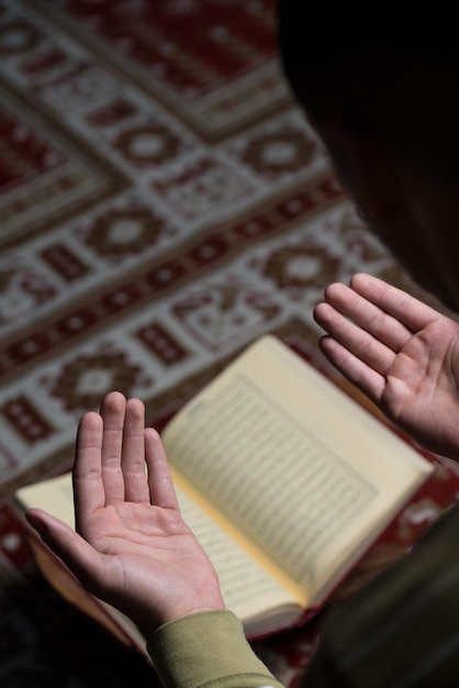 Midsection of woman reading book