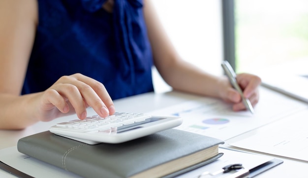 Midsection of woman working on table