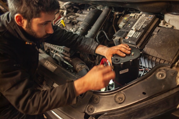 MILAN ITALY 24 APRIL 2022 Mechanic repairs car detail