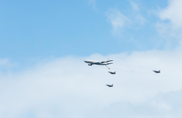 Military aircraft against the blue sky