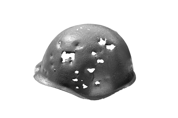 Military helmet pierced by bullets and shrapnel isolated on white background for militarythemed project or design