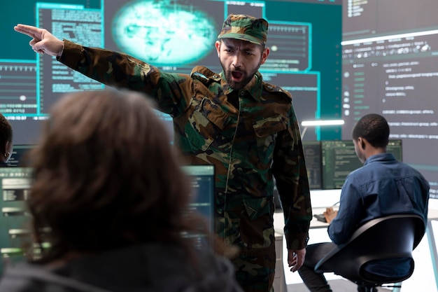 Military IT experts working on cyber security in a high tech government office