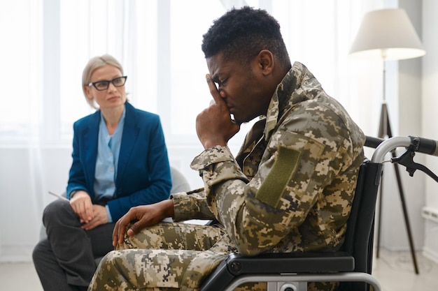 Military man with disability at therapy session