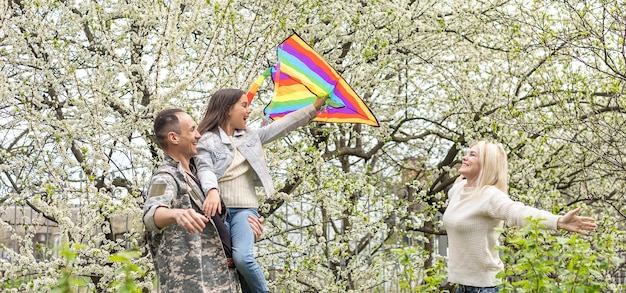 military reunion between father and daughter. military dad embracing his daughter on his homecoming. Army soldier.