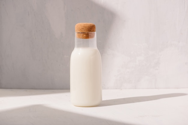 Milk bottle on a white table