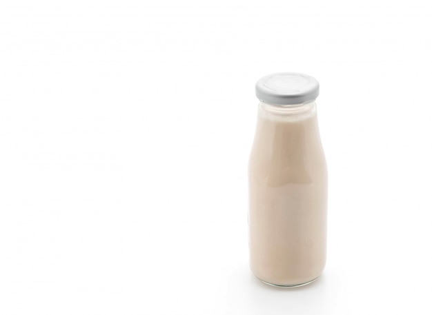 milk in bottle on white