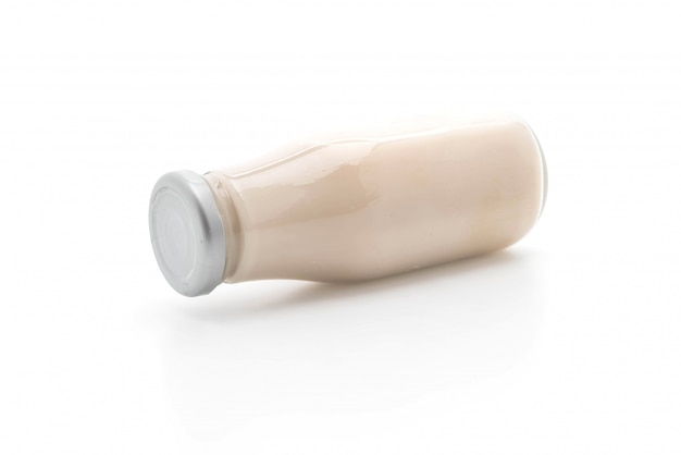 milk in bottle on white