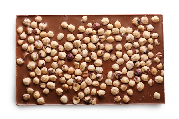 Milk chocolate bar with hazelnuts isolated on white