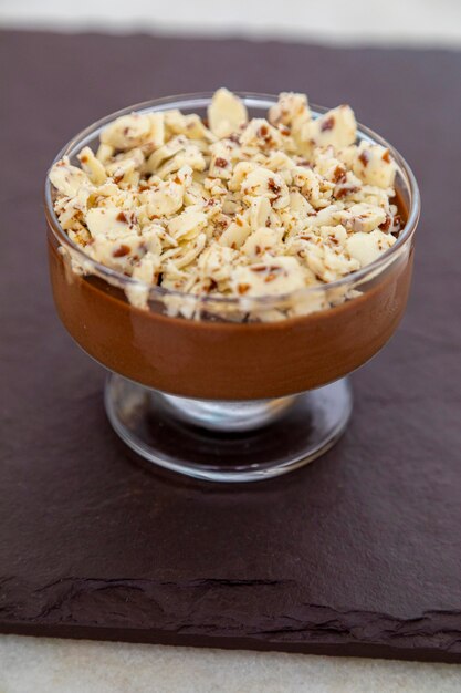 Milk chocolate mousse with chocolate shavings.