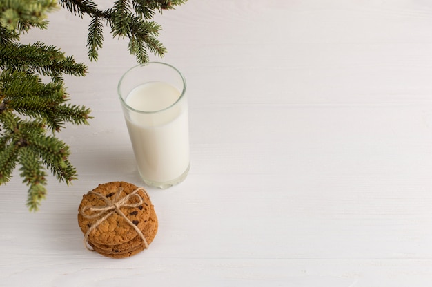 Milk and cookies for Santa Claus under the christmas tree