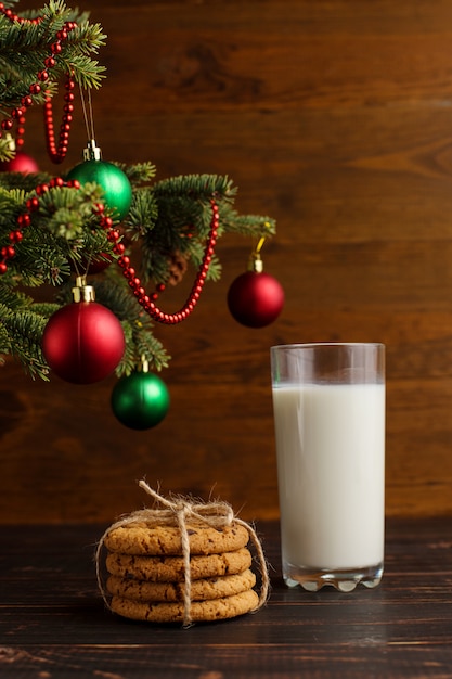 Milk and cookies for Santa Claus under the christmas tree